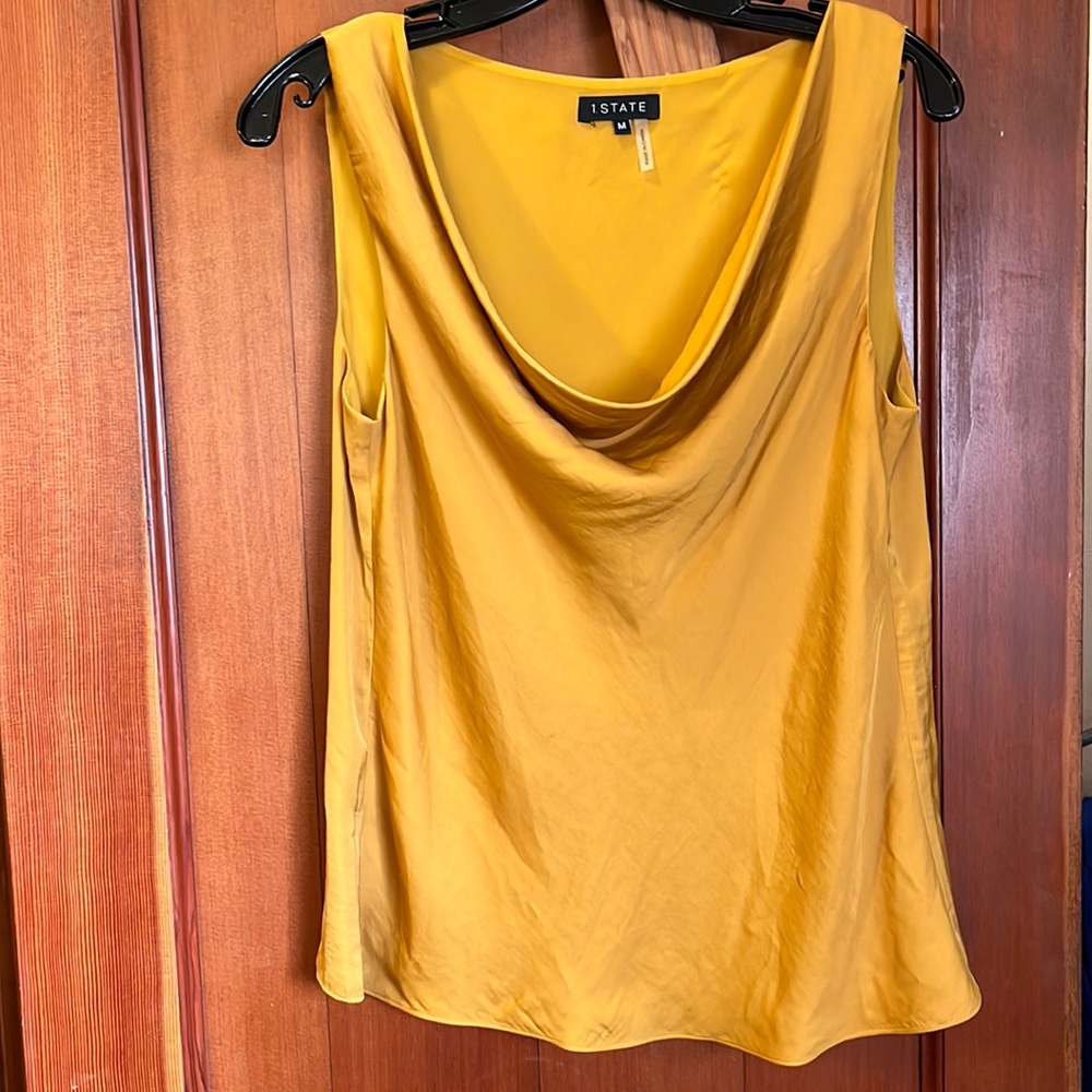 Gold sleeveless drape neck polyester shirt. Size medium.